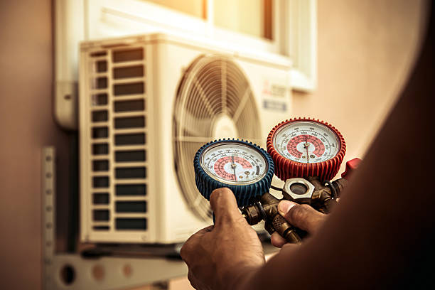 Professional Air Conditioning Service technician working in Owensville, IN
